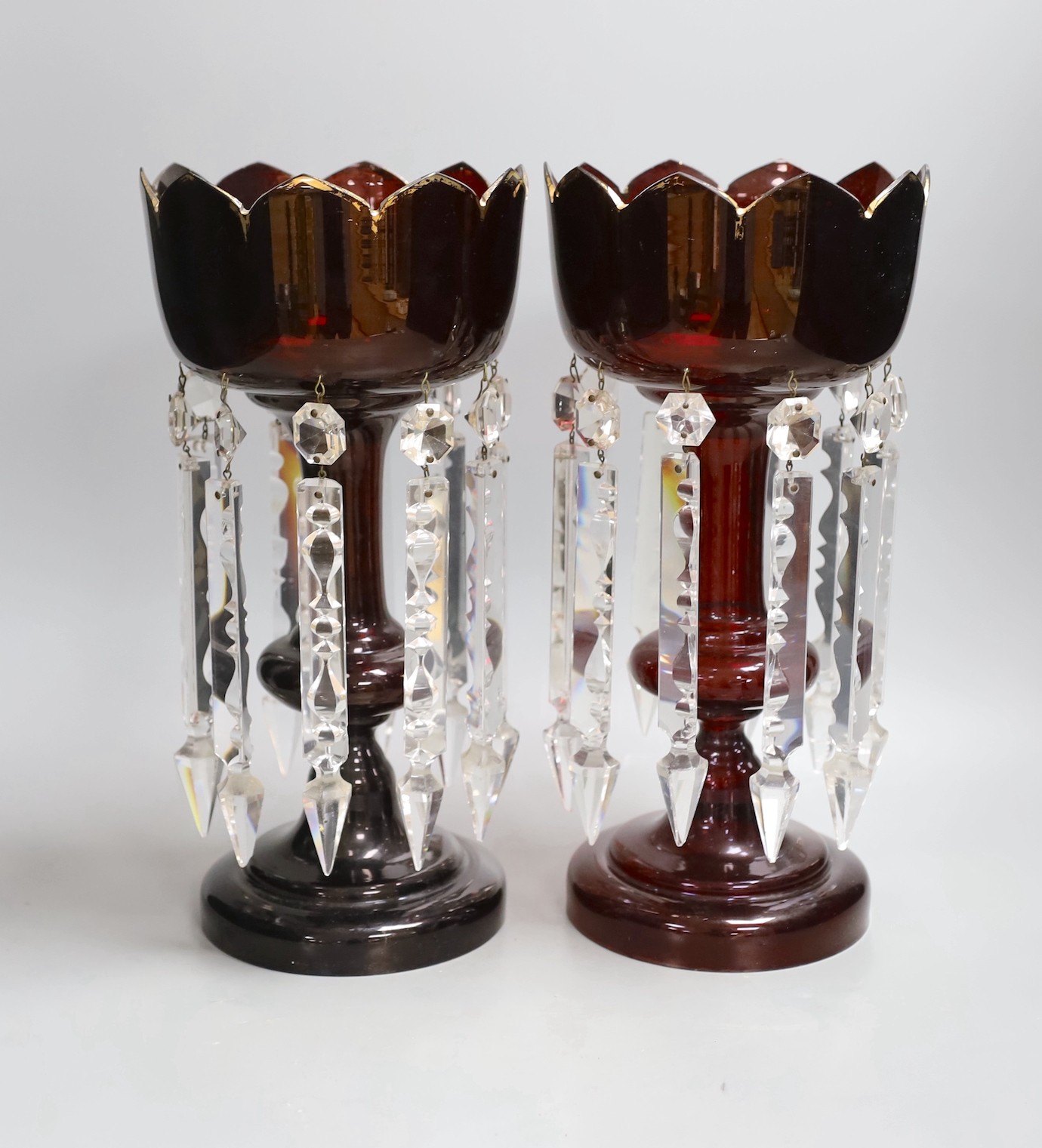 A pair of 19th century ruby glass table lustres, 34cm